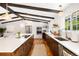 Spacious kitchen featuring a large island, stainless steel appliances, and abundant natural light at 7371 Otis Ct, Arvada, CO 80003