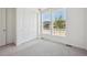 Inviting bedroom featuring large windows, neutral carpet, and closet for ample storage at 9091 Telluride Ct, Commerce City, CO 80022