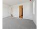Simple bedroom with neutral walls and flooring, showcasing clean design and functional space at 9091 Telluride Ct, Commerce City, CO 80022