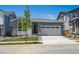 Charming single-Gathering home with a two-car garage, stone accents, and fresh landscaping at 9091 Telluride Ct, Commerce City, CO 80022