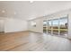 Bright, spacious living area with floor to ceiling glass doors leading to an outdoor deck at 9091 Telluride Ct, Commerce City, CO 80022