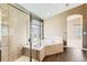 Bathroom features a glass-enclosed shower and a luxurious soaking tub with jets at 1905 Graphite Ct, Castle Rock, CO 80108