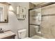 Updated bathroom featuring modern vanity, updated fixtures, and a glass enclosed shower with updated tile at 1905 Graphite Ct, Castle Rock, CO 80108