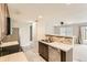 Bright kitchen with tiled countertops, stainless steel appliances, and an open layout at 1905 Graphite Ct, Castle Rock, CO 80108