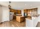 Spacious kitchen featuring an island, stainless steel appliances, and hardwood flooring at 1905 Graphite Ct, Castle Rock, CO 80108
