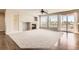 Bright living room featuring a fireplace, large windows, and access to the balcony offering style and comfort at 1905 Graphite Ct, Castle Rock, CO 80108