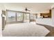 Open-concept living area with hardwood floors, fireplace and access to the kitchen, perfect for Gathering gatherings at 1905 Graphite Ct, Castle Rock, CO 80108