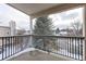 Private balcony overlooking a tree-lined street at 5341 W 76Th Ave # 221, Arvada, CO 80003