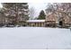 Community building and fenced yard with snow cover at 5341 W 76Th Ave # 221, Arvada, CO 80003