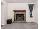 Stone fireplace with black metal screen at 5341 W 76Th Ave # 221, Arvada, CO 80003