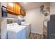 Laundry area with washer, dryer, and storage cabinets at 5341 W 76Th Ave # 221, Arvada, CO 80003