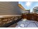 Private backyard with stone wall, wooden fence, and patio area at 1126 S Yampa St, Aurora, CO 80017