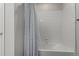 Bathroom with shower/tub combo and white tile at 1126 S Yampa St, Aurora, CO 80017