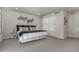 King-size bed in bright bedroom with gray carpet at 1126 S Yampa St, Aurora, CO 80017