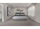 Spacious bedroom with large bed, carpet, and neutral decor at 1126 S Yampa St, Aurora, CO 80017
