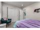 Bedroom with teal chair and purple bedding at 1126 S Yampa St, Aurora, CO 80017