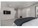 Main bedroom with large bed, TV, and access to hallway at 1126 S Yampa St, Aurora, CO 80017
