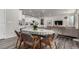 Bright dining area features a mid-century modern table with six chairs at 1126 S Yampa St, Aurora, CO 80017