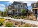 Beautiful two-story home with stone accents, manicured landscaping, and a black metal fence at 1126 S Yampa St, Aurora, CO 80017