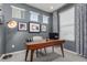 Bright home office features a large desk and window at 1126 S Yampa St, Aurora, CO 80017