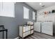 Laundry room with washer, dryer, and storage at 1126 S Yampa St, Aurora, CO 80017