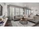 Bright living room featuring a sectional sofa and modern decor at 1126 S Yampa St, Aurora, CO 80017
