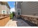 Private side yard with paver stones and fencing, perfect for outdoor relaxation at 1126 S Yampa St, Aurora, CO 80017