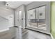 Bright and airy entryway with hardwood floors and frosted glass door at 1927 Eaton St, Lakewood, CO 80214