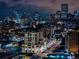 Stunning nighttime view of the city skyline with illuminated buildings and bustling streets at 975 N Lincoln St # 10A, Denver, CO 80203