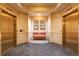 Elevator lobby with two elevators, decorative wall art and a bench seating area at 975 N Lincoln St # 10A, Denver, CO 80203