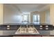 This kitchen features a double sink, black countertops, and a breakfast bar open to the living room at 975 N Lincoln St # 10A, Denver, CO 80203