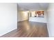 Bright living room with wood flooring that seamlessly transitions to an open-concept kitchen with modern appliances at 975 N Lincoln St # 10A, Denver, CO 80203