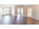 Spacious living room with wood flooring, connecting to a bathroom and multiple rooms, perfect for entertaining at 975 N Lincoln St # 10A, Denver, CO 80203