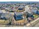 Aerial view of a blue home with a backyard playset, surrounded by a suburban neighborhood at 16333 Prairie Farm Cir, Parker, CO 80134