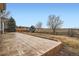 Spacious stamped concrete patio overlooking a large open area with a playset in the distance at 16333 Prairie Farm Cir, Parker, CO 80134