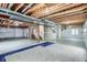 Unfinished basement with exposed wood rafters at 16333 Prairie Farm Cir, Parker, CO 80134