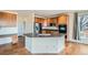 Open-concept kitchen featuring a breakfast bar, stainless steel appliances, and plenty of counter space at 16333 Prairie Farm Cir, Parker, CO 80134