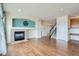 Spacious living room boasts a cozy fireplace and hardwood floors, perfect for relaxing and entertaining at 16333 Prairie Farm Cir, Parker, CO 80134