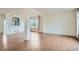 Inviting living room with hardwood floors, archway features, and ample natural light at 16333 Prairie Farm Cir, Parker, CO 80134