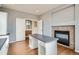 Open office space with a fireplace, bright light and open access to the rest of the home at 16333 Prairie Farm Cir, Parker, CO 80134