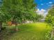Spacious backyard with mature tree for shade and lush green lawn at 4670 E Euclid Cir, Centennial, CO 80121