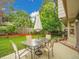 Deck with outdoor dining area, surrounded by lush greenery at 4670 E Euclid Cir, Centennial, CO 80121