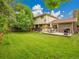 Spacious backyard with a well-manicured lawn and deck at 4670 E Euclid Cir, Centennial, CO 80121