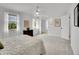 Large primary bedroom with carpet and a view into the primary bathroom at 4670 E Euclid Cir, Centennial, CO 80121