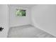 Clean bedroom with a carpet floor, large window and closet space at 4670 E Euclid Cir, Centennial, CO 80121