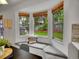 Bright breakfast nook featuring a cushioned bench, window views, and a connection to the kitchen at 4670 E Euclid Cir, Centennial, CO 80121