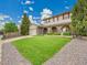 Inviting two-story home showcasing a lush green lawn, brick detailing, and a convenient attached garage at 4670 E Euclid Cir, Centennial, CO 80121