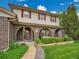 The front porch displays beautiful brick archways and well-maintained landscaping adding curb appeal at 4670 E Euclid Cir, Centennial, CO 80121