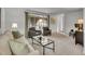Inviting living area boasting neutral carpet, brick accented windows and a relaxed and comfortable layout at 4670 E Euclid Cir, Centennial, CO 80121