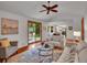 Open living room with sliding glass doors to outdoor patio and connection to the kitchen at 4670 E Euclid Cir, Centennial, CO 80121